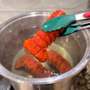 Remove lobster tails from pot.