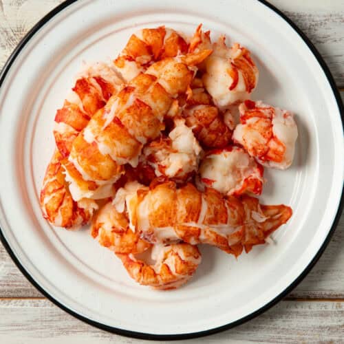 Cooked Maine lobster tail meat on a plate