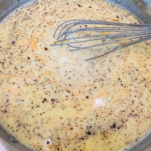 Mix warm milk and roux.